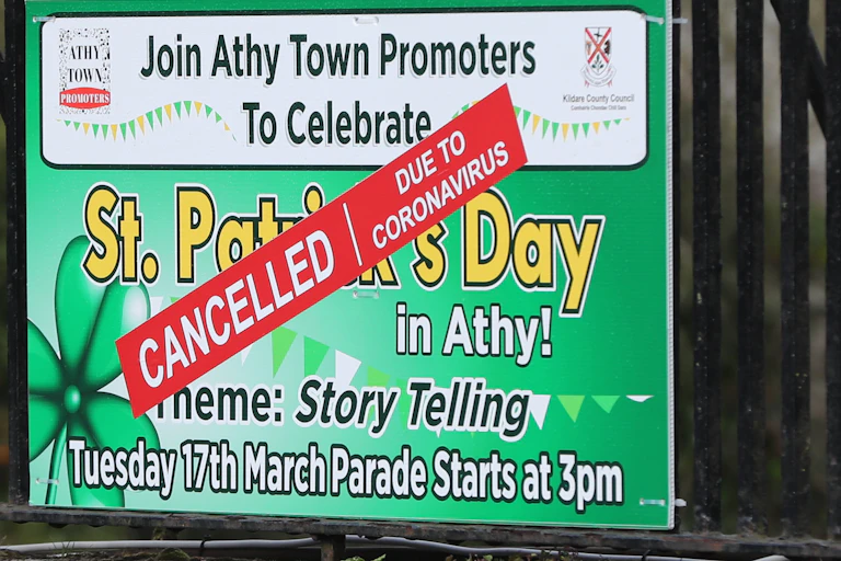 A St. Patrick's day banner with a cancelled sign over it.