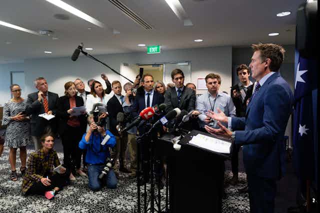 Christian Porter appears before  a Perth press conference