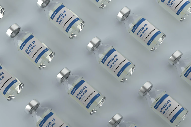 Vials of COVID vaccines laid out symmetrically