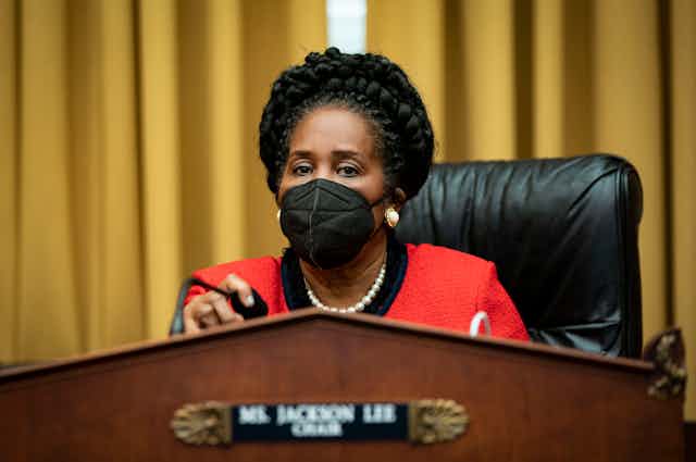 House Rep. Sheila Jackson Lee  presides over a Congressional meeting