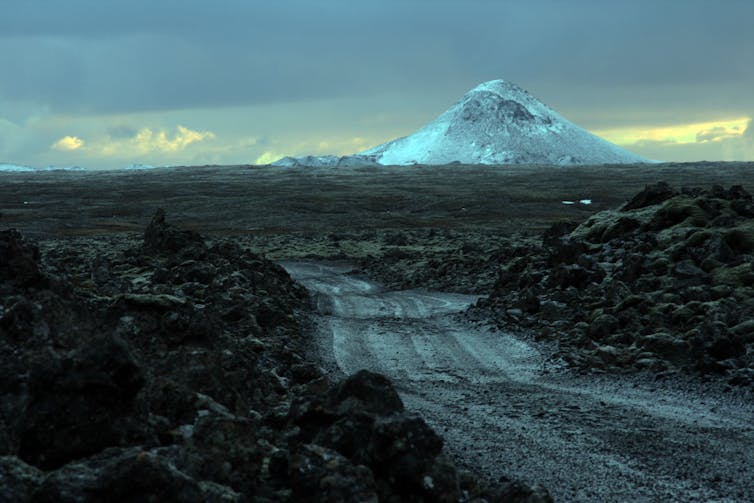 A dramatic image of the snow-covered volcano Mt Keilir just south of Reykjavik in Iceland.