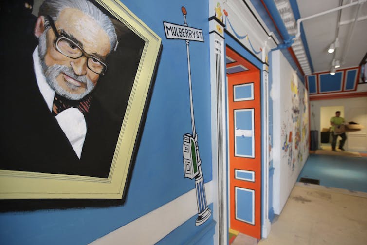 Portrait of man on colourful wall