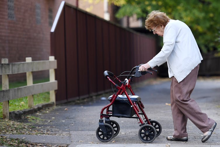 Elderly woman going for a walk.