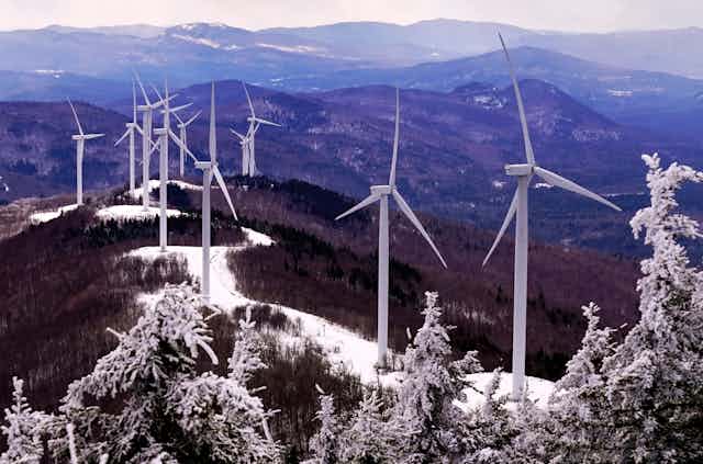 Wind turbines on a snowy ridge in Maine, February 2021