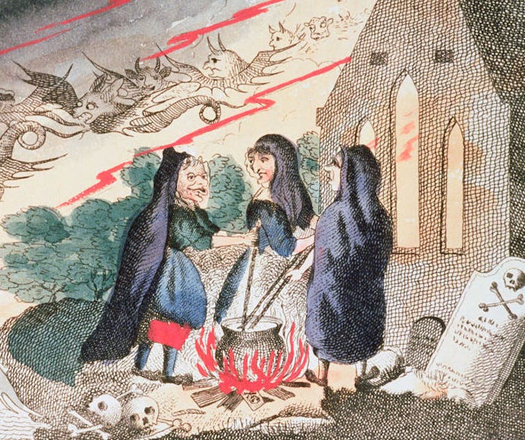 Three witches stand around a cauldron.