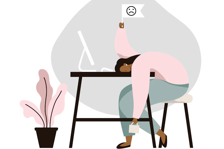 An illustration of a woman slumped her desk with a white flag in the air.