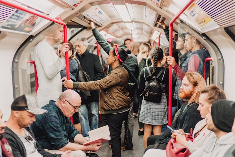 A crowded carriage on the London Underground.