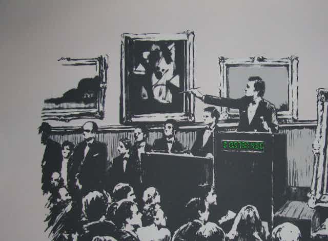 A piece of artwork by Banksy, showing an auction room with a painting of the words "I can't believe you morons actually buy this shit" on it.