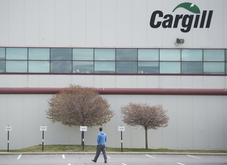 A man walks into a Cargill meat processing factory
