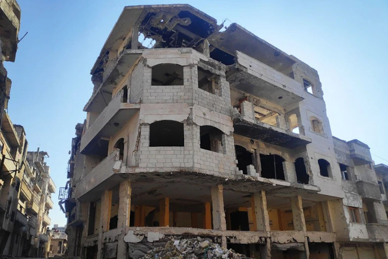 The shell of an apartment building damaged by an explosion.