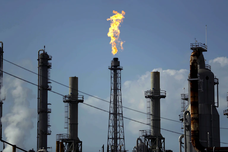 A flame burns at the Shell Deer Park oil refinery in Texas.