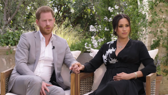 Prince Harry and Meghan Markle holding hands during interview