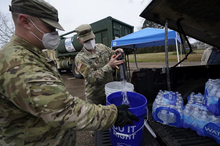 National Guard members supplying water during a disaster