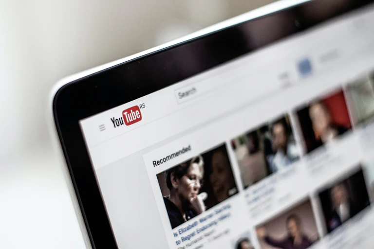 Blurred image of laptop screen showing YouTube content