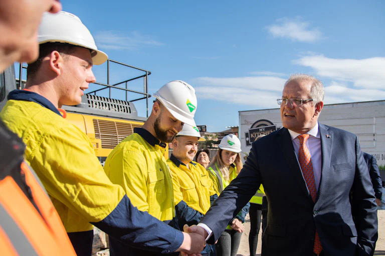 Scott Morrison shaking the hand of a construction worker