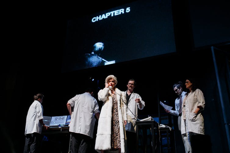 The cast in white lab coats.