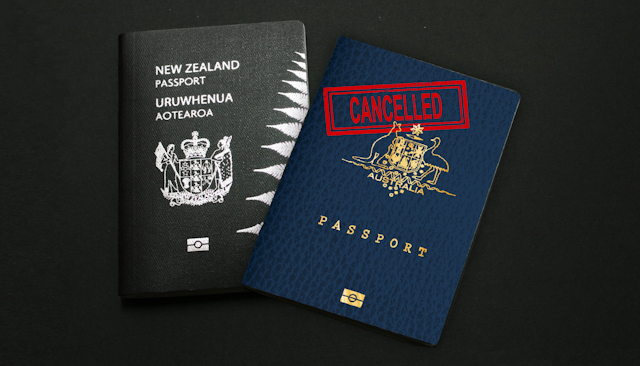 A New Zealand passport and an Australian passport that is marked cancelled.