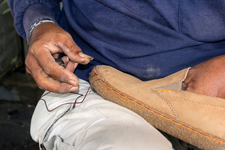 Man fixes shoe