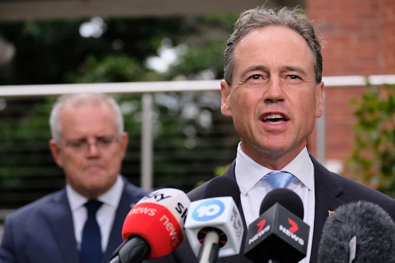 Greg Hunt, with Scott Morrison in the background