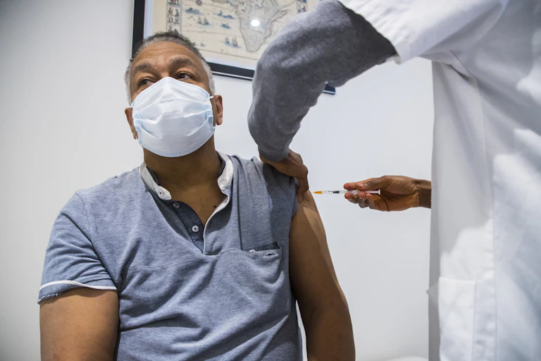 A man receiving dose of the AstraZeneca vaccine in Paris