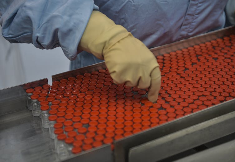 A technician works with the Soberana 02 COVID-19 vaccine