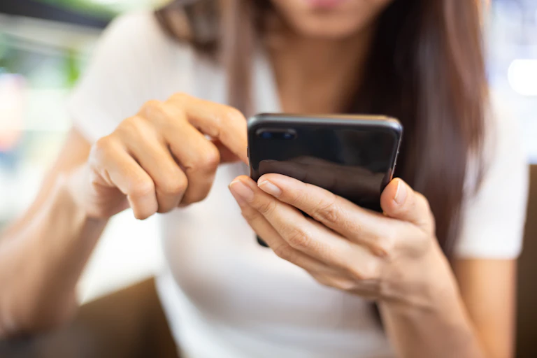 Woman looking at her phone.