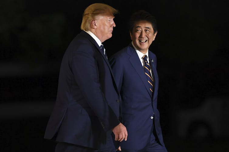 US president Donald Trump and Japanese prime minister Shinzo Abe walking together during the G20 summit in Osaka, Japan, 2019.