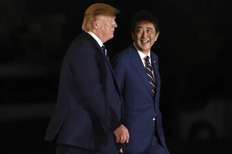 US president Donald Trump and Japanese prime minister Shinzo Abe walking together during the G20 summit in Osaka, Japan, 2019.
