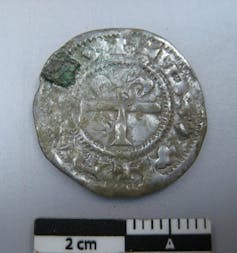 A 4cm-wide worn silver coin.