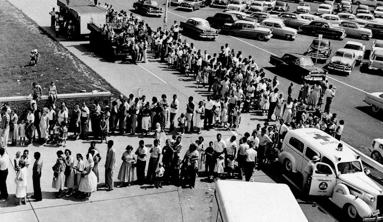 A long line of people waiting for polio vaccines in Illinois in 1959