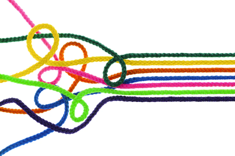 Tangled ropes becoming organized.