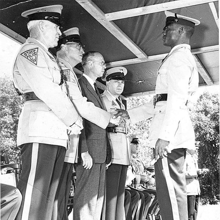 A Black man graduating from the New Jersey state police academy