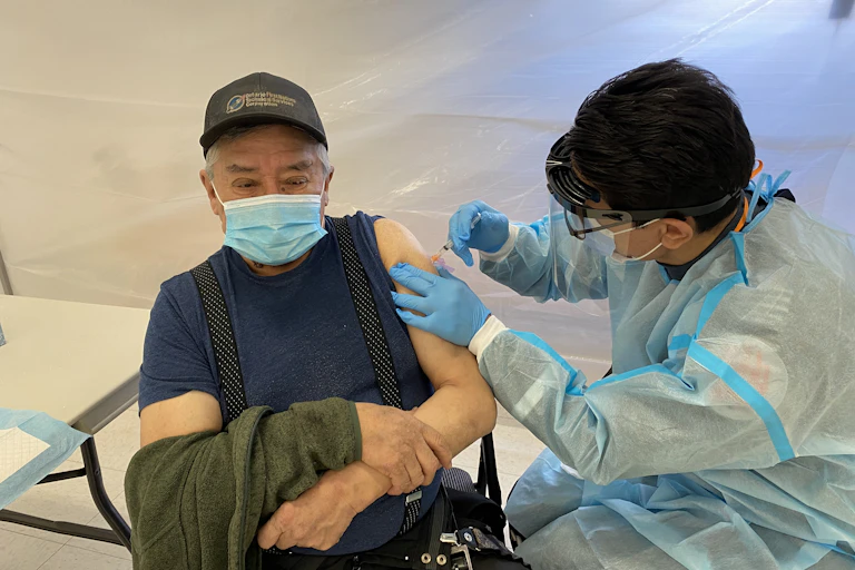 Indigenous man receives vaccine