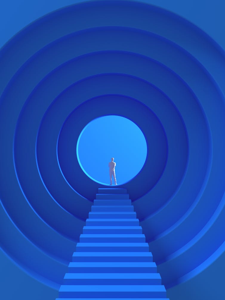 A long tunnel with a person at one end