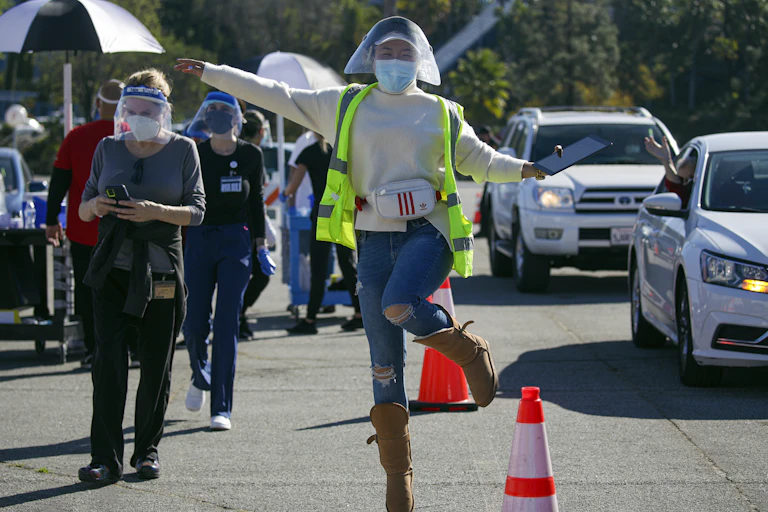 A joyful healthcare worker at a mass vaccination site
