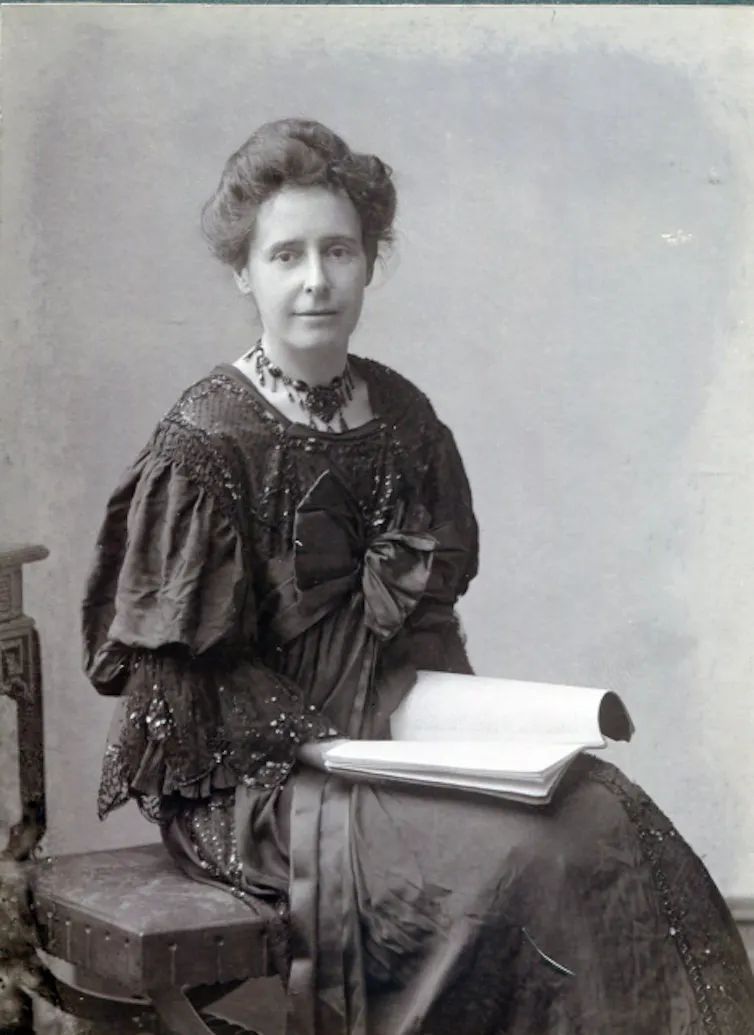 A woman sitting with a book on her lap