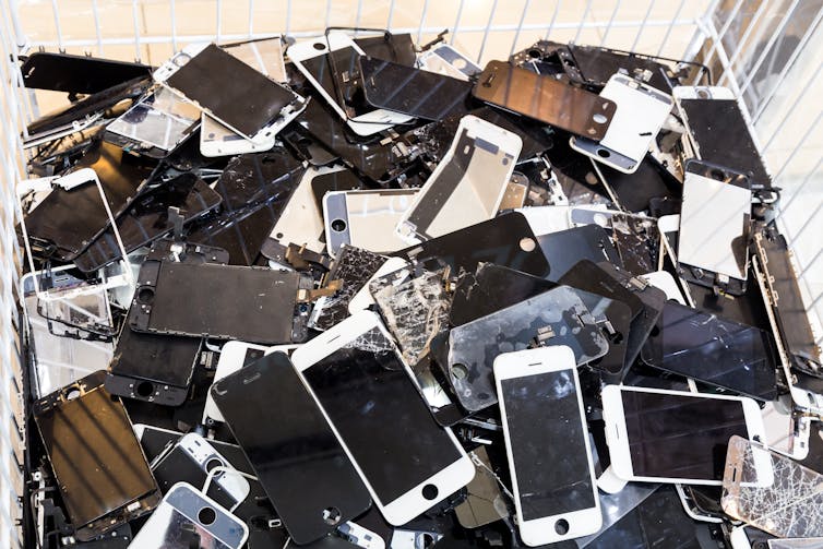 Pile of smashed, discarded smartphones