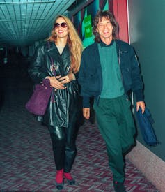 Jerry Hall and Mick Jagger walking together in 1993