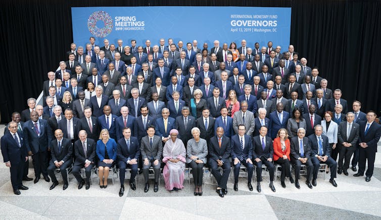 International Monetary Fund governors pose for a picture during an annual meeting.