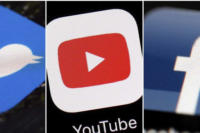Combination of images shows logos for companies from left, Twitter, YouTube and Facebook.