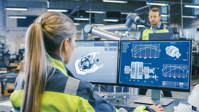 Woman engineer working with technical drawings on a computer screen