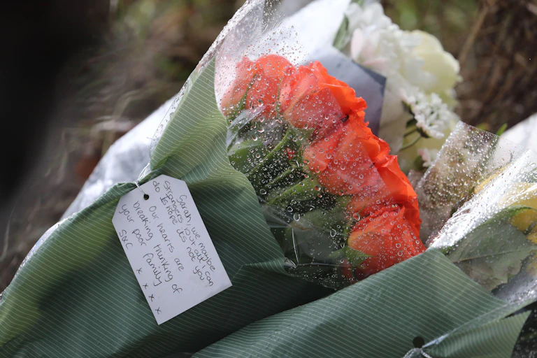 A bunch of roses in wrapping paper with a note addressed to Sarah Everard who went missing in London on March 3.