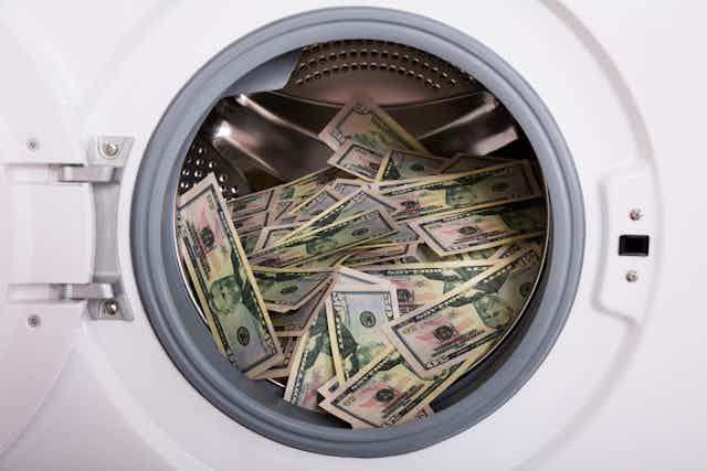 Money pictured inside a laundry machine.