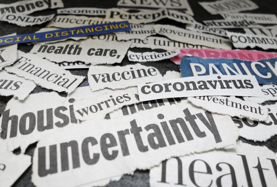 Newspaper headline words cut out relating to covid