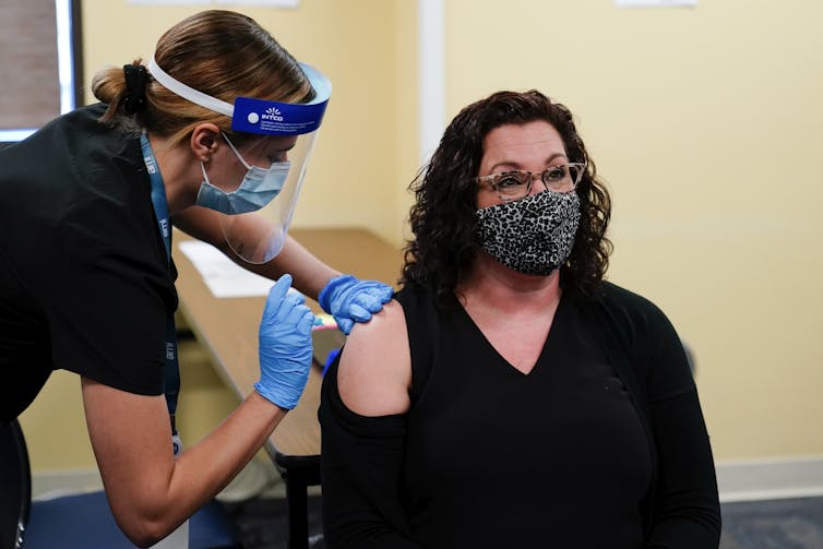 A woman receives her vaccine in the United States.
