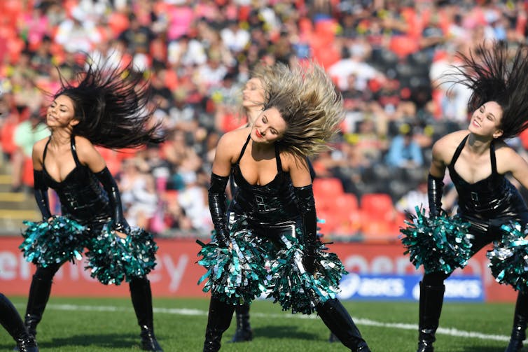 Cheerleaders in leather and push-up bras.