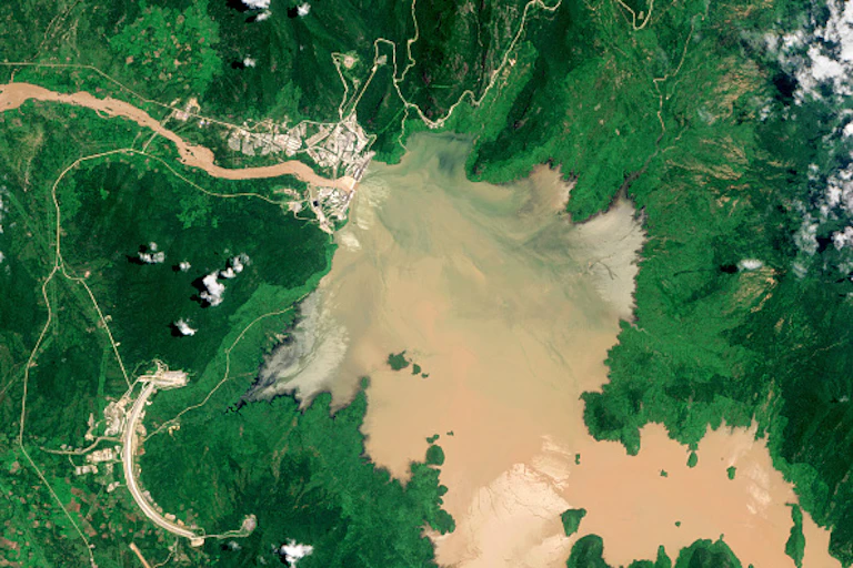Aerial view of water filling up a dam.
