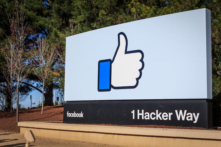 Billboard with the thumbs-up icon at Facebook HQ in Menlo Park, California.