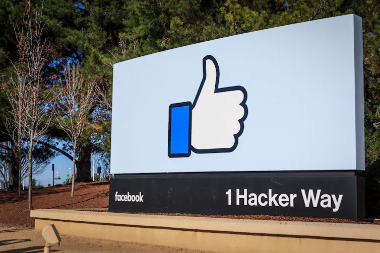 Billboard with the thumbs-up icon at Facebook HQ in Menlo Park, California.