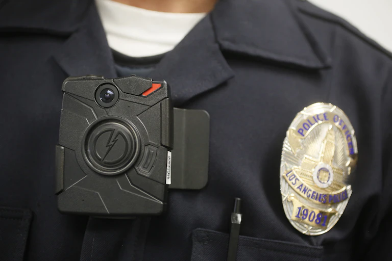 A police officer wears a body camera